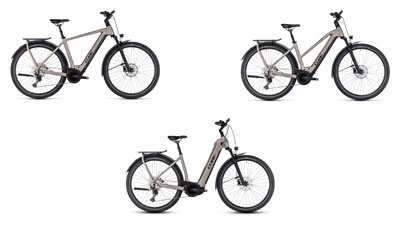 Her ses tre grå Cube Kathmandu Hybrid-elcykler, henholdsvis med en diamantramme, en trapezramme og en lavstigeramme.