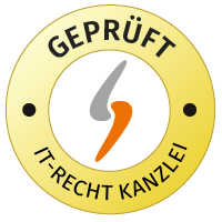 Der vises et rundt logo for IT-Recht-Kanzlei i gul og hvid med ordet »AUDITED GTC«.