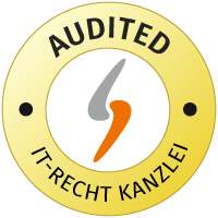 Der vises et rundt logo for IT-Recht-Kanzlei i gul og hvid med mærket AUDITED.